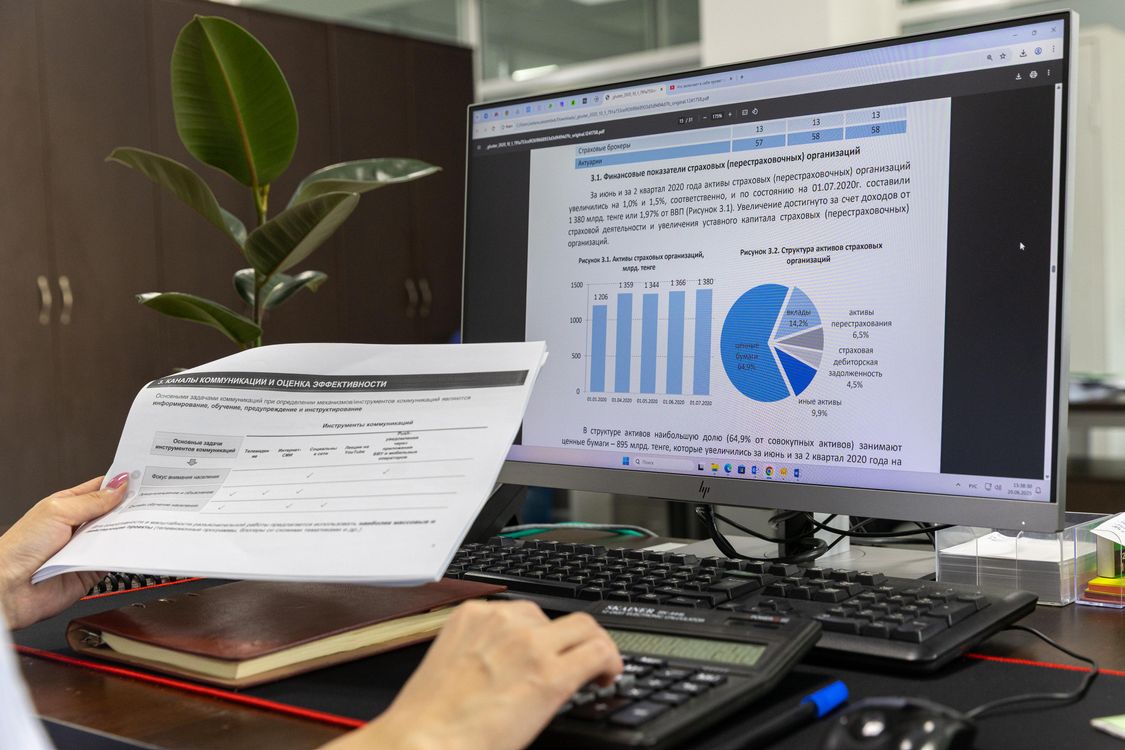 Analyst reviewing operational data on a desktop monitor