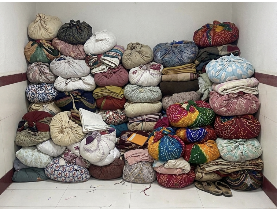 Organized garment bundles awaiting the istriwala's repeatable service process